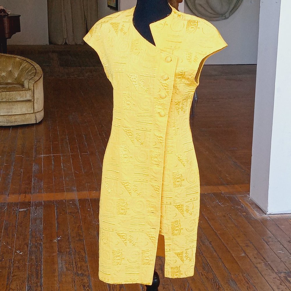 Yellow Avant guard buttoned down dress. Still missing a button.